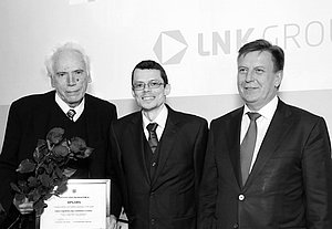 Dr. phys. Kaspars Ērglis and Academician of Latvian Academy of Science (LAS) Prof. Andrejs Cēbers receiving LAS “Science Award 2016” for their study “Flexible magnetic string modelling and synthesis”. Left to right: Prof. A. Cēbers, K. Ērglis and the Prime Minister of Latvia Māris Kučinskis. 